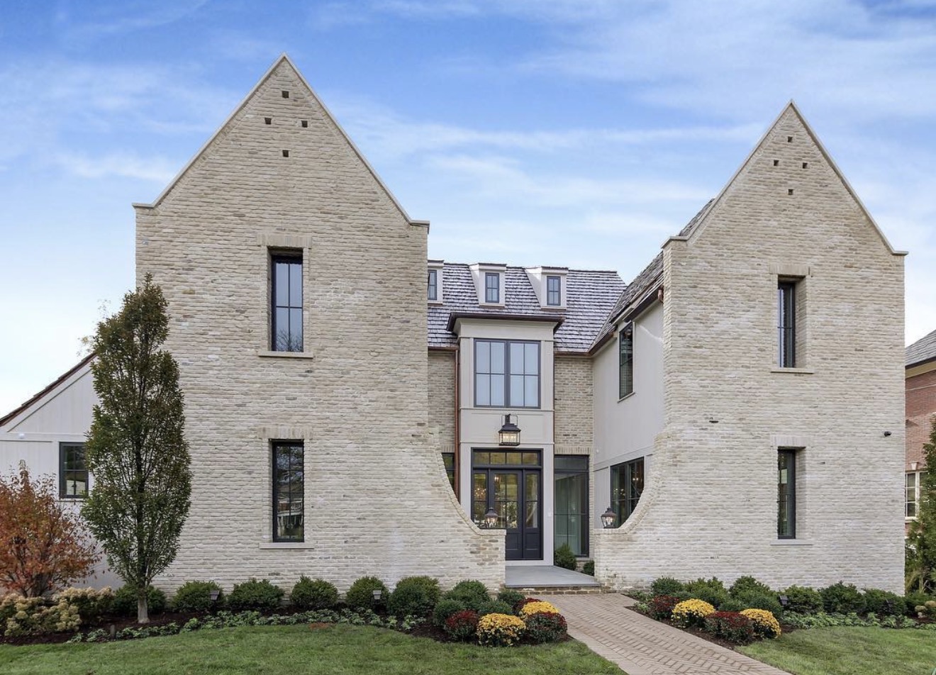 Modern limestone residence with steep gables
