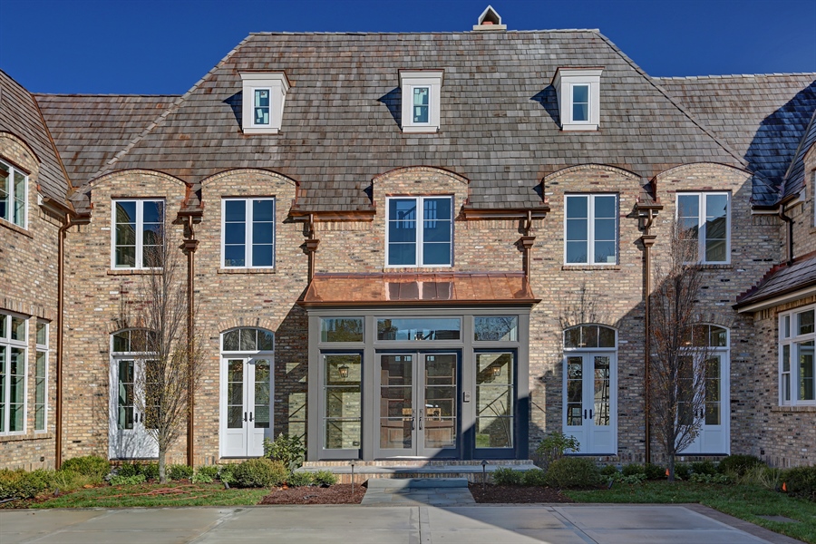 Traditional brick residence with a formal central entry